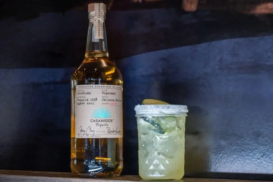 Casamigos Reposado tequila beside a jalapeño margarita at Tequila Mama Taqueria