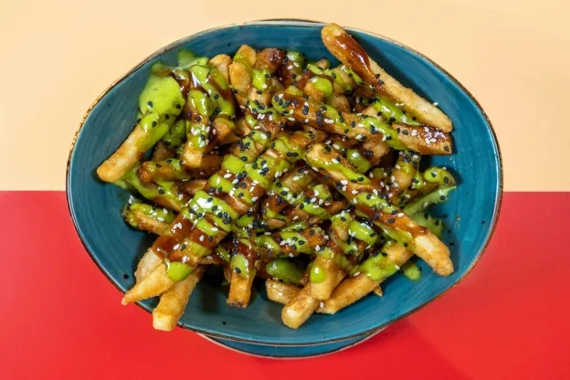 Korean Krack Fries loaded with sauces and sesame seeds at Tequila Mama Taqueria